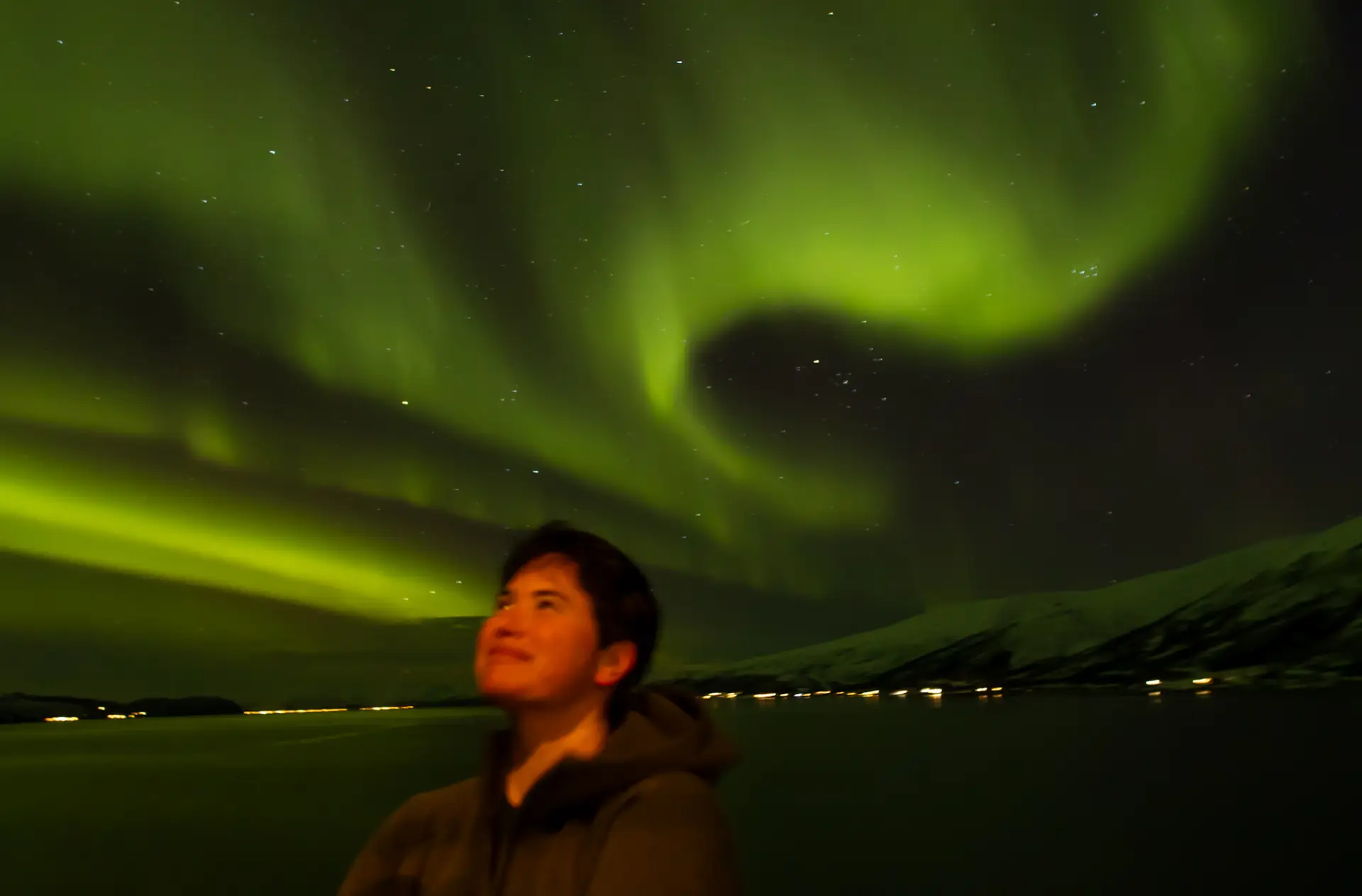 Regan against a Northern Lights backdrop